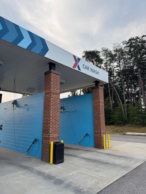 Titan Auto Wash facility with modern blue and brick exterior