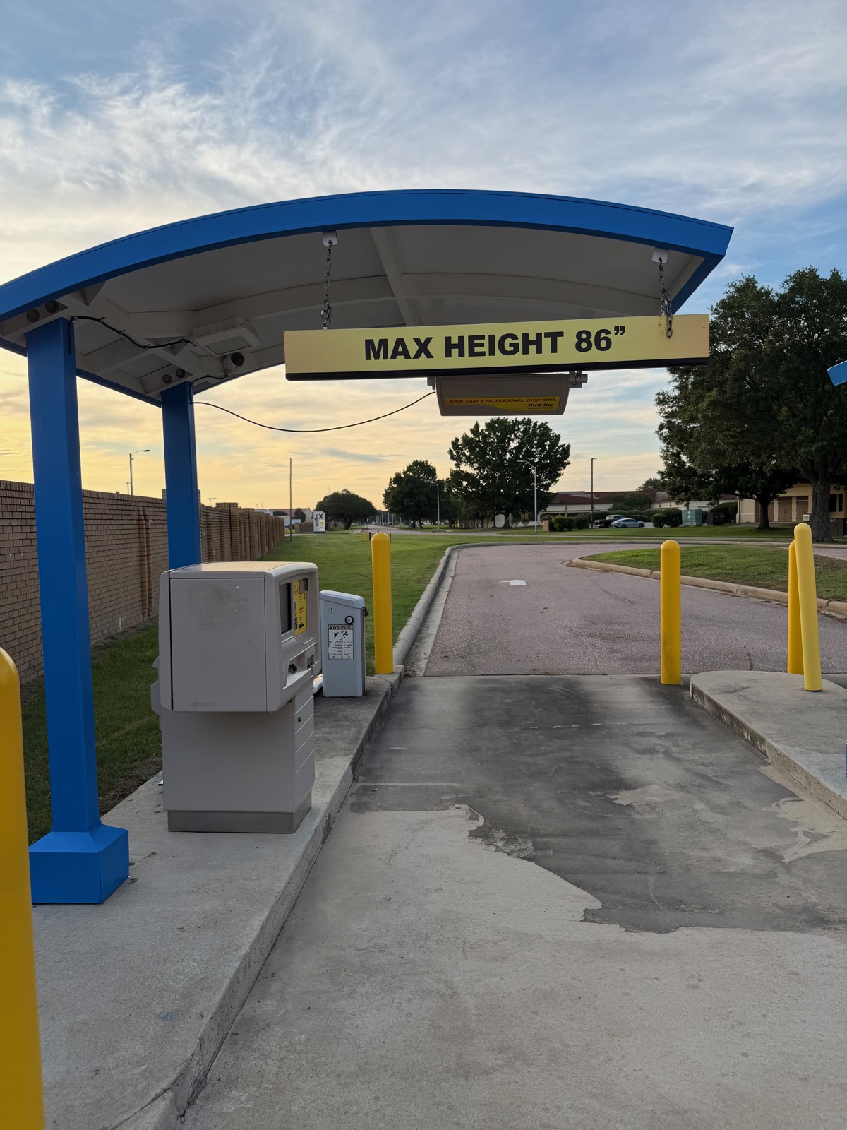 Entry pay station at Titan Auto Wash, Maxwell AFB at dusk